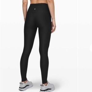 Lululemon Mapped Out High-Rise Tight Size 4 w/28" inseam 
Black w/pattern